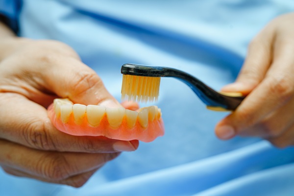 Signs You Need To Seek Professional Care For Your Dentures